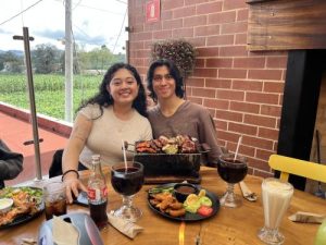 Nathan Maldonado and a friend enjoy food on a terrace